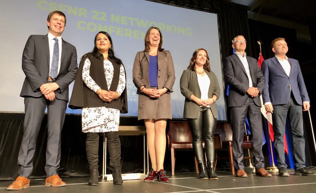 UCP leadership candidates (L-R) Todd Loewen, Rajan Sawhney, Danielle Smith, Rebecca Schulz, Travis Toews, and Brian Jean pose for a group photo at the Canada Strong and Free Regional Networking Conference 2022 in Red Deer, Alberta, on Sept. 24, 2022. (Noé Chartier/The Epoch Times)