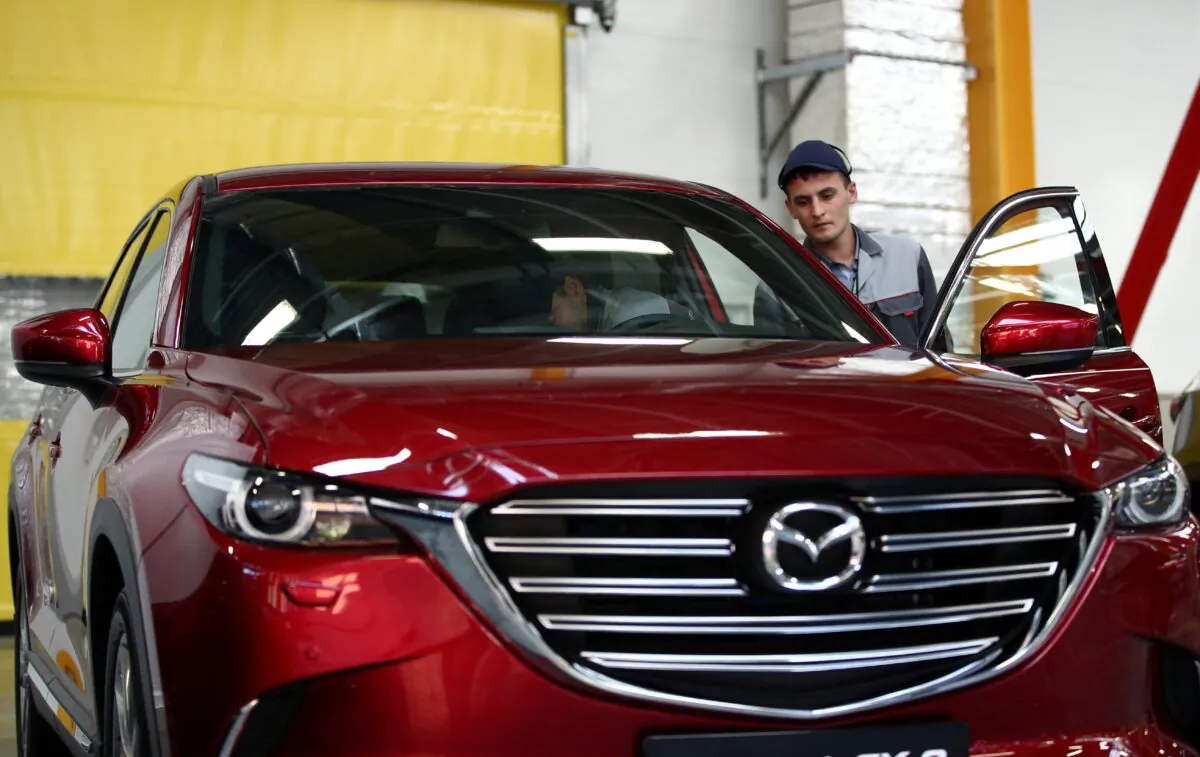 Employees work on the production line of the CX-5 model car at the Mazda Sollers Manufacturing Rus joint venture plant of Sollers and Japanese Mazda in Vladivostok, Russia September 10, 2018. (Valery Sharifulin/TASS Host Photo Agency/Pool via REUTERS)