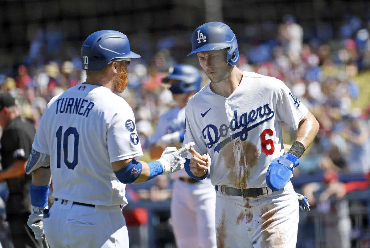 Trea Turner (6) of the Los Angeles Dodgers is congratulated by Justin Turner (10) after scoring a run against starting pitcher Adam Wainwright (50) of the St. Louis Cardinals during the first inning at Dodger Stadium in Los Angeles, on Sept. 25, 2022. (Kevork Djansezian/Getty Images)