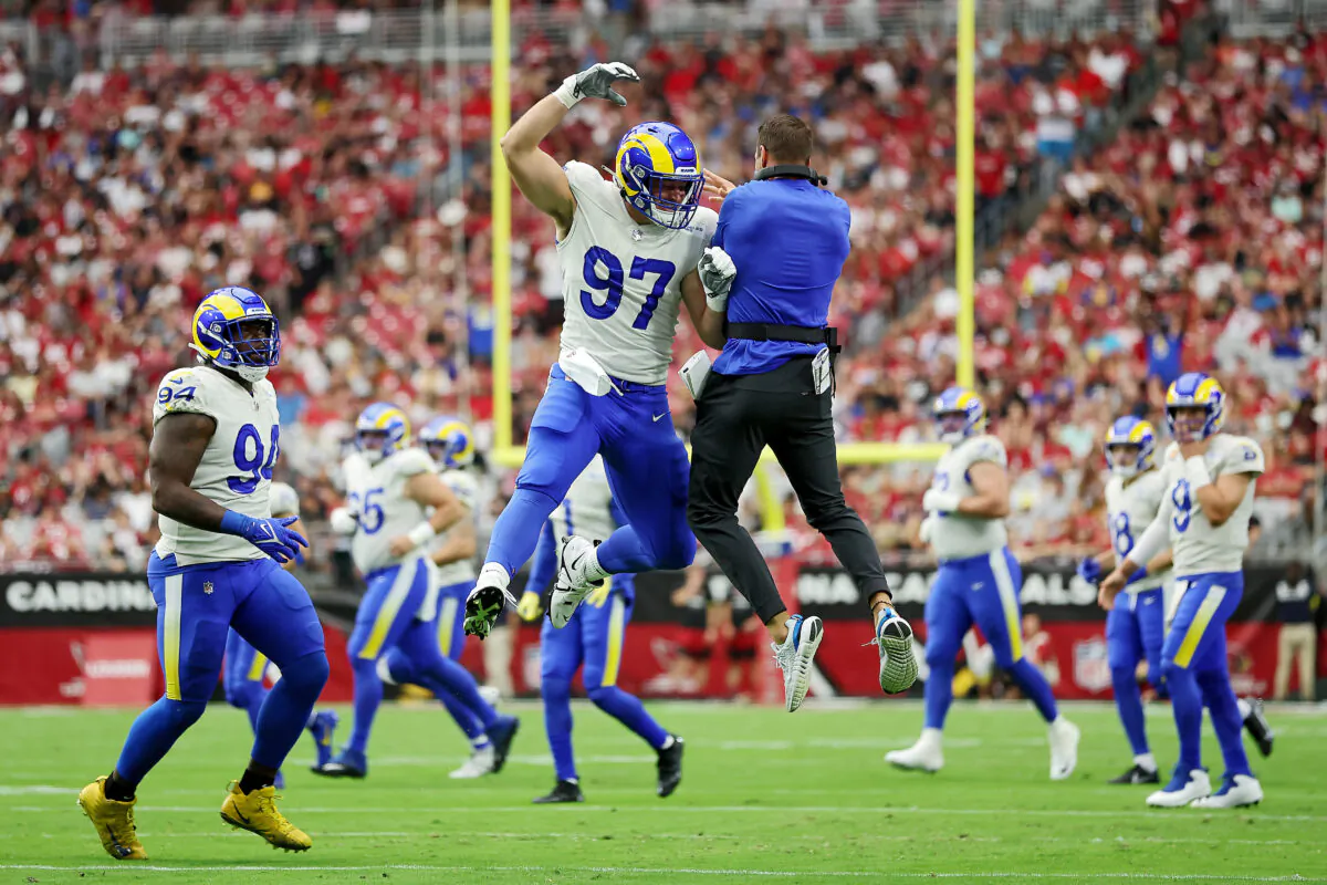 Michael Hoecht (97) of the Los Angeles Rams celebrates with head coach Sean McVay during the first quarter at State Farm Stadium in Glendale, Ariz., on Sept. 25, 2022. (Christian Petersen/Getty Images)