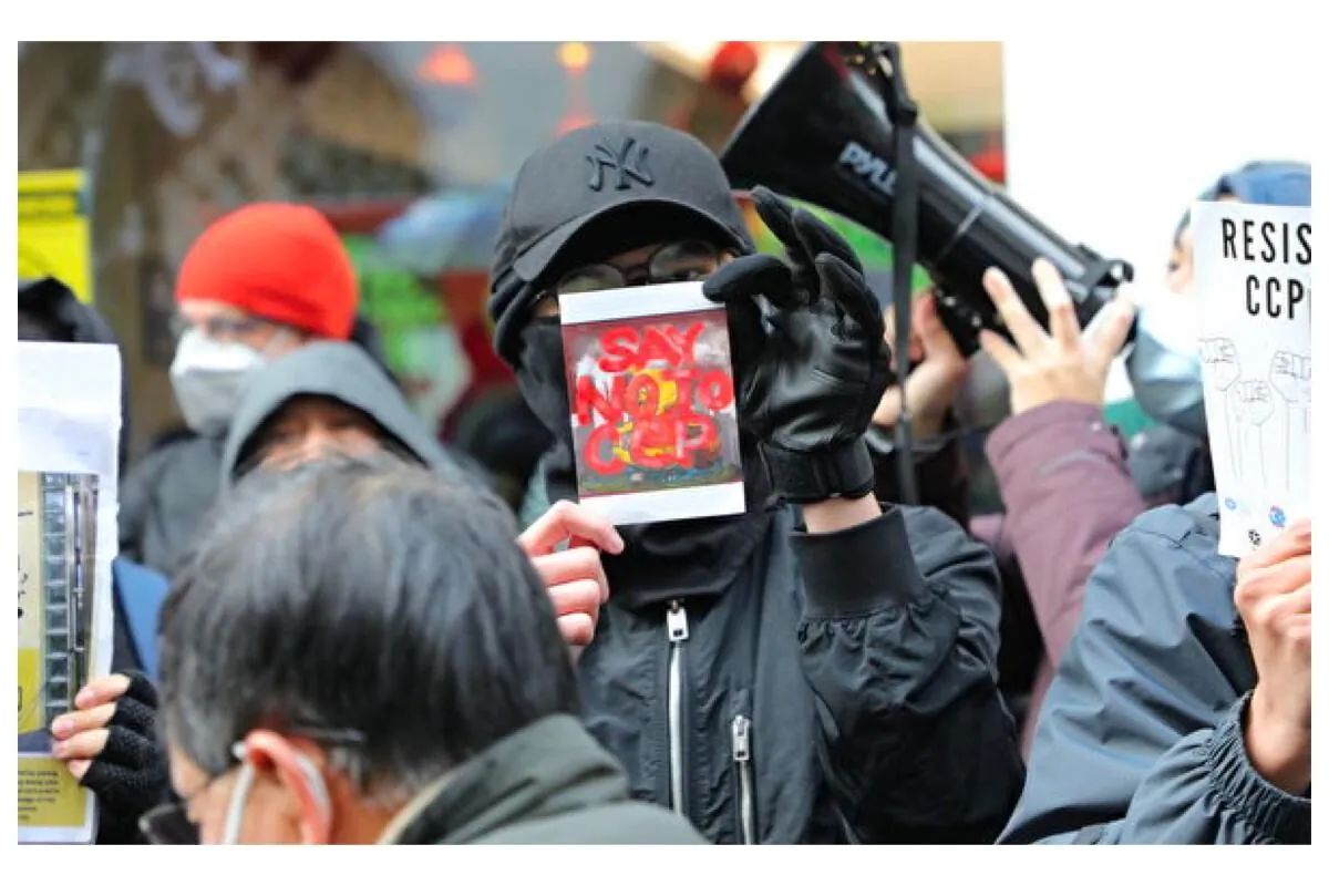 A source used a British government website to identify a suspected former Hong Kong police superintendent and an agent of the CCP who recently established a Hong Kong student and family organization in Britain. Their purpose is suspected to be to influence and control people from Hong Kong, a report revealed. (William Luke/The Epoch Times)