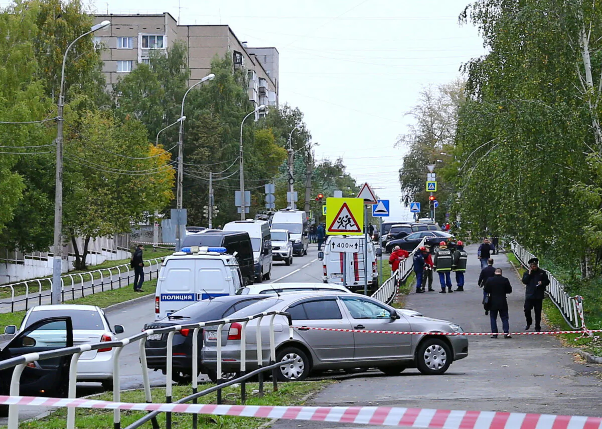 Police and members of emergency services work near the scene of a school shooting in Izhevsk, Russia, on Sept. 26, 2022. (Stringer/Reuters)