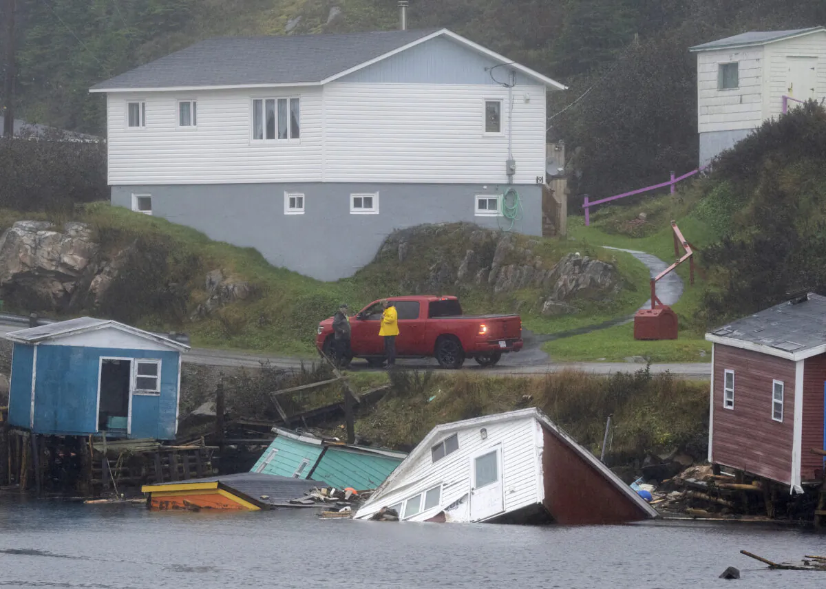 Buildings sit in the water along the shore following hurricane Fiona in Rose Blanche-Harbour Le Cou, Newfoundland, on Sept. 27, 2022. (Frank Gunn/The Canadian Press)