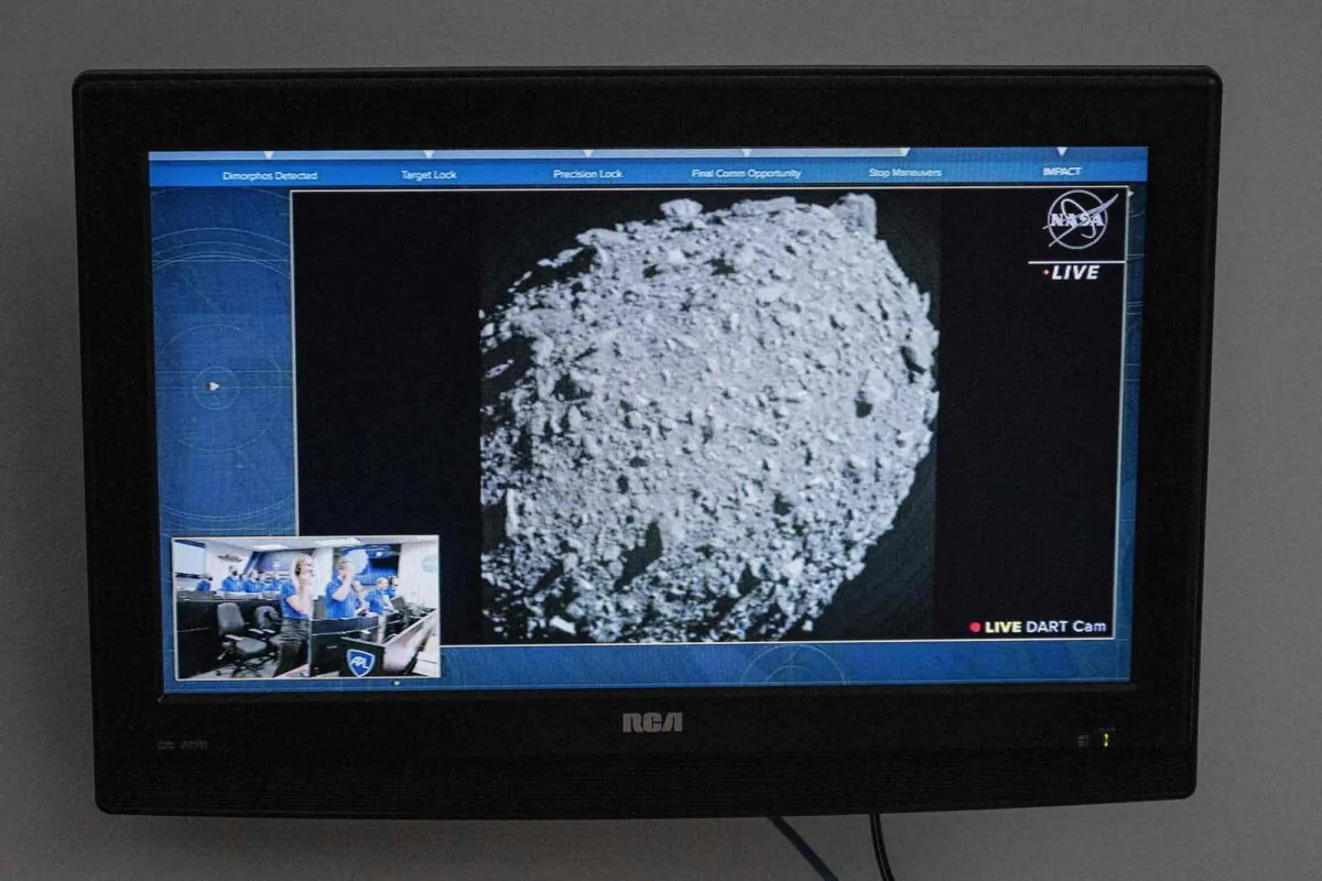 A television at NASA's Kennedy Space Center in Cape Canaveral, Florida, captures the final images from the Double Asteroid Redirection Test (DART) just before it smashes into the asteroid Dimorphos, on Sept. 26, 2022. (Jim Watson/AFP via Getty Images)