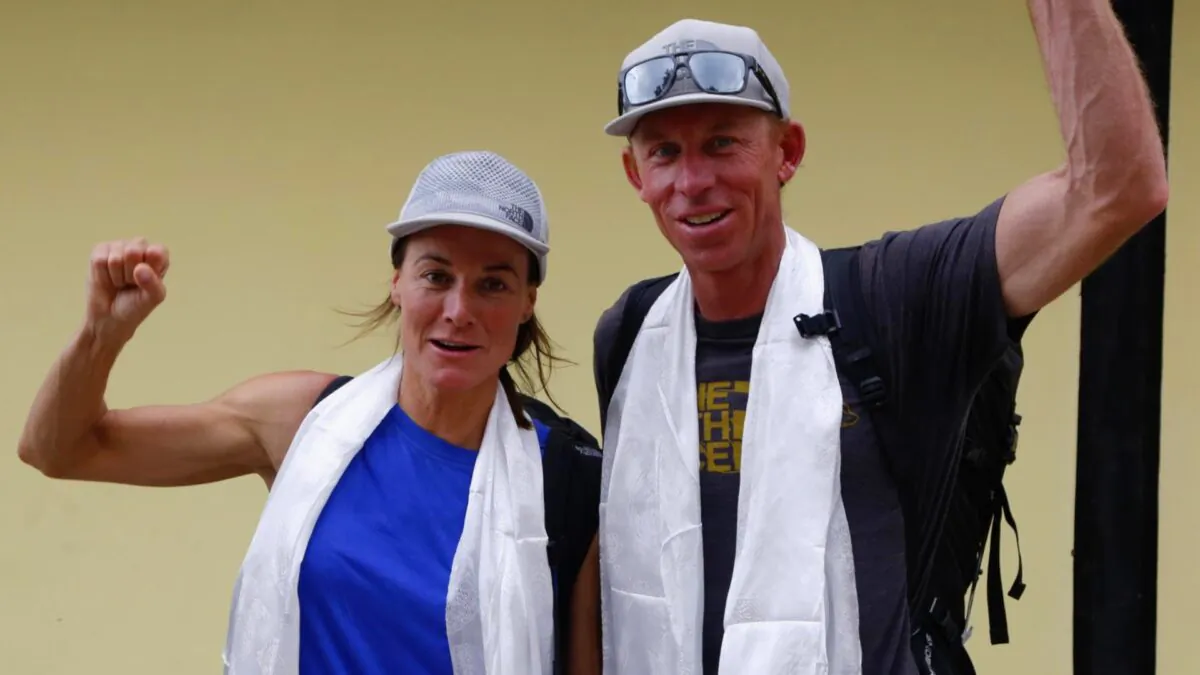 Hilaree Nelson and James Morrison raise their fists as the pair arrived in Kathmandu, Nepal, on Oct. 4, 2018. (Niranjan Shrestha/AP Photo)