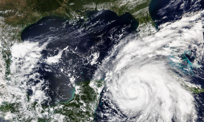 A satellite image shows Hurricane Ian growing stronger as it barreled toward Cuba on Sept. 26, 2022. (NASA Worldview/Earth Observing System Data and Information System (EOSDIS) via AP)