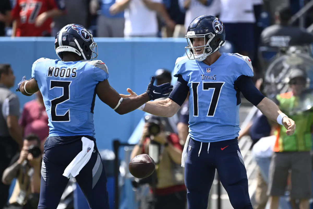 Tennessee Titans quarterback Ryan Tannehill (17) celebrates with Robert Woods (2) after Tannehill ran for a touchdown against the Las Vegas Raiders in the first half of an NFL football game in Nashville, on  Sept. 25, 2022. (Mark Zaleski/AP Photo)
