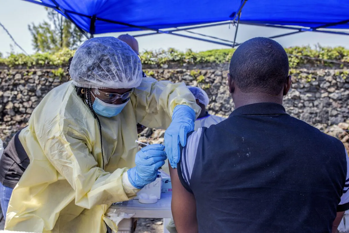 A man receives a vaccine against Ebola from a nurse outside the Afia Himbi Health Center in Goma, Congo, on July 15, 2019. (Pamela Tulizo/AFP via Getty Images)