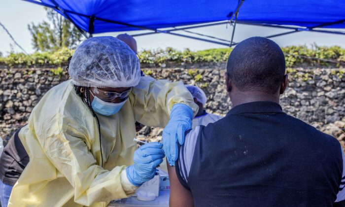 A antheral   receives a vaccine against Ebola from a caregiver  extracurricular  the Afia Himbi Health Center successful  Goma, Congo connected  July 15, 2019. (Pamela Tulizo/AFP via Getty Images)