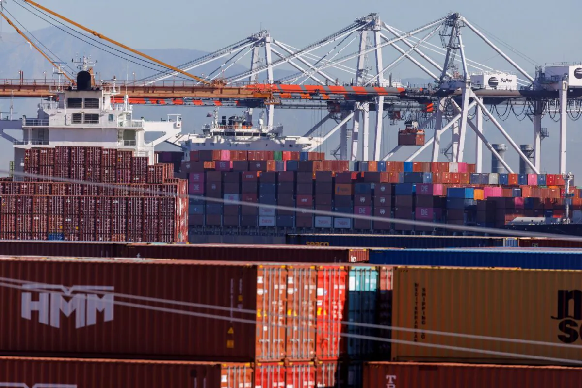 Stacked containers as ships unload their cargo at the Port of Los Angeles on Nov. 22, 2021. (Mike Blake/Reuters)