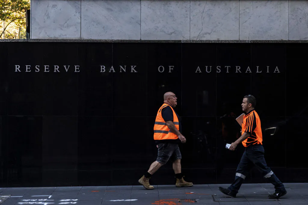 Pedestrians walk past the Reserve Bank of Australia building in Sydney, Australia, on May 3, 2022. (Brook Mitchell/Getty Images)