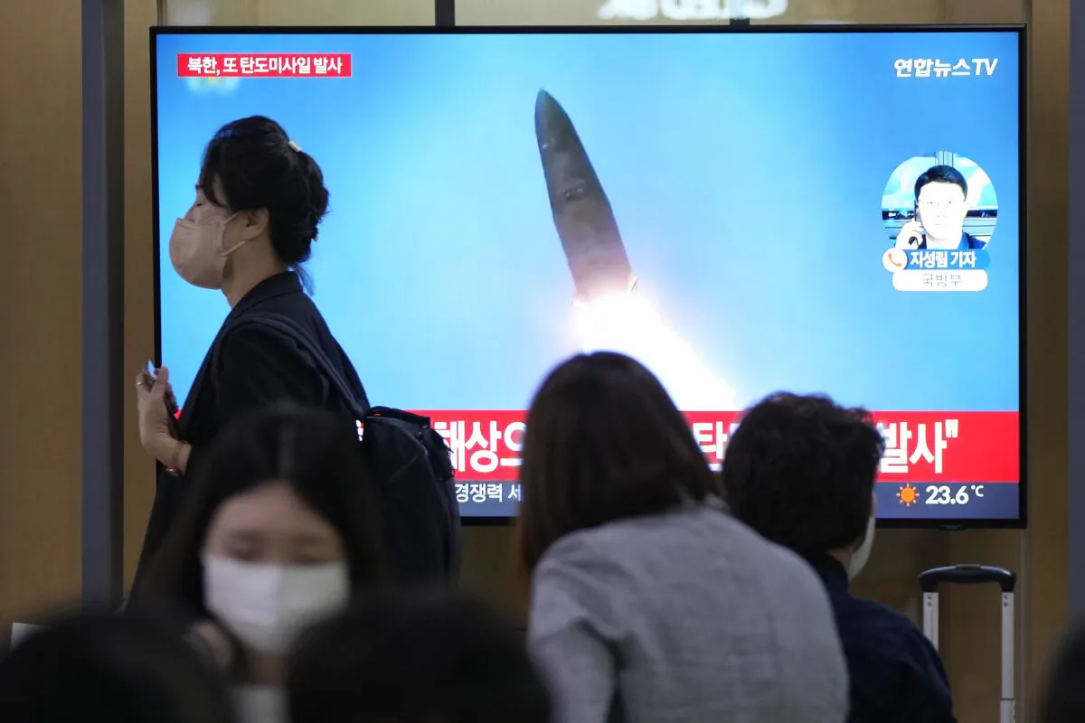 A TV screen shows a file image of a North Korean missile launch during a news program at the Seoul Railway Station in Seoul, South Korea, on Sept. 28, 2022. (Ahn Young-joon/AP Photo)