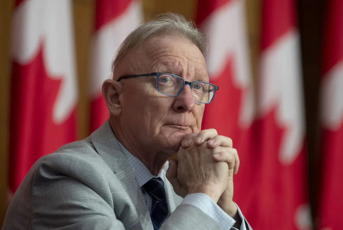 Senator Pierre-Hugues Boisvenu listens to a virtual speaker during a news conference in Ottawa, Mar. 30, 2021. (The Canadian Press/Adrian Wyld)