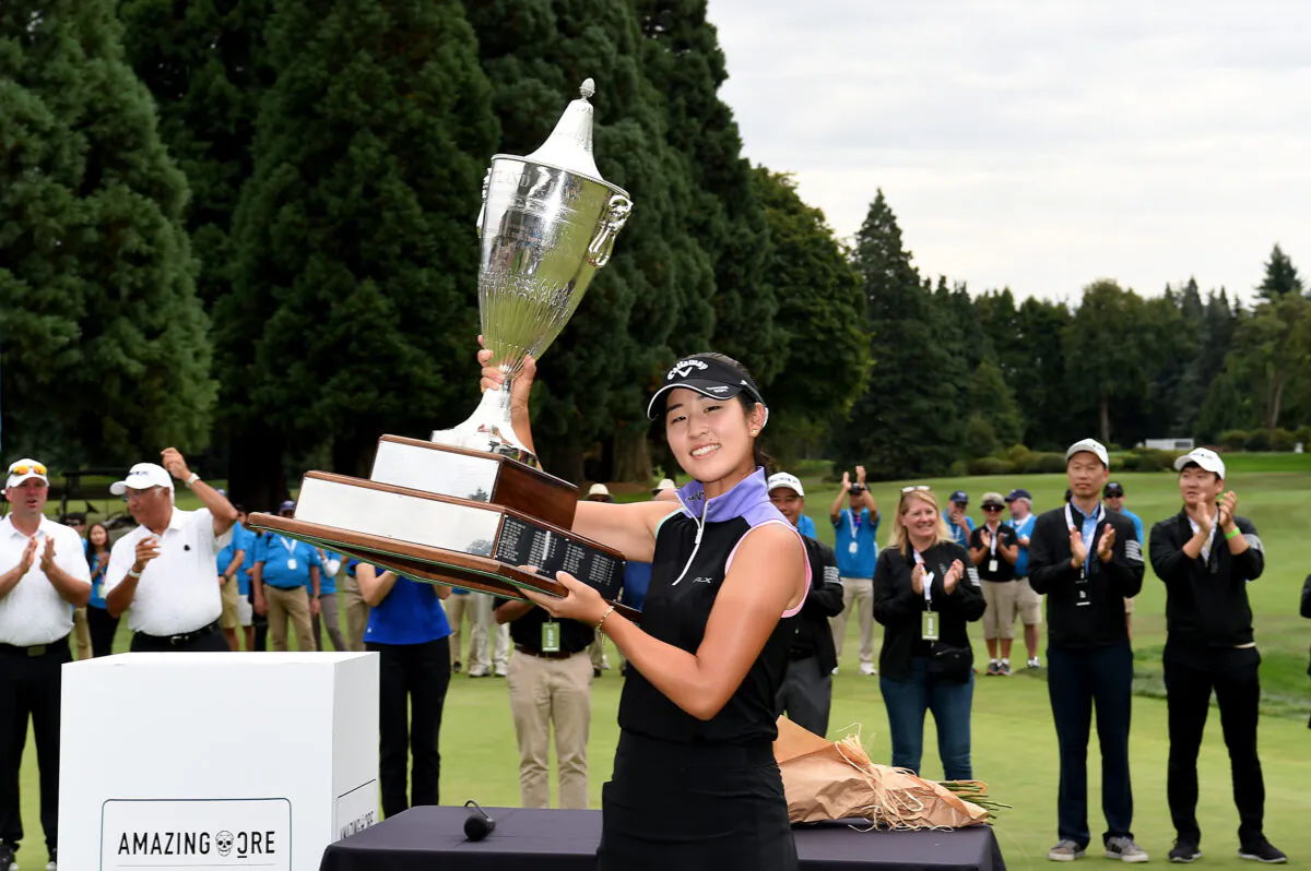 Andrea Lee poses with the trophy after winning the AmazingCre Portland Classic at Columbia Edgewater Country Club in Portland, Ore., on September 18, 2022. (Steve Dykes/Getty Images)