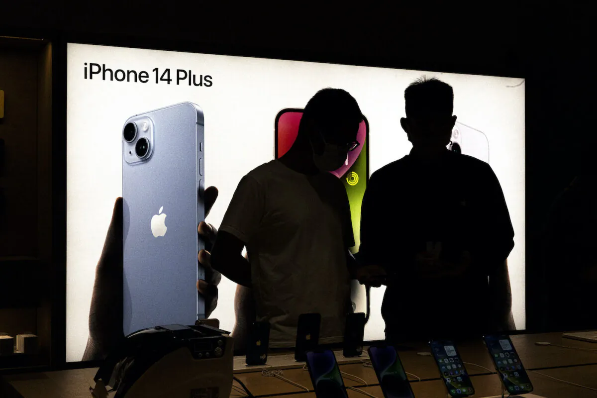 Customers look at the new iPhone 14 at an Apple store in Wuhan, Hubei Province, China, on Sept. 16, 2022. (Getty Images)