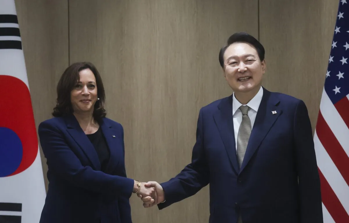 U.S. Vice President Kamala Harris (L) and South Korea's President Yoon Suk Yeol pose for a photo as they hold a bilateral meeting in Seoul, South Korea, on Sept. 29, 2022. (Leah Millis/Pool Photo via AP)