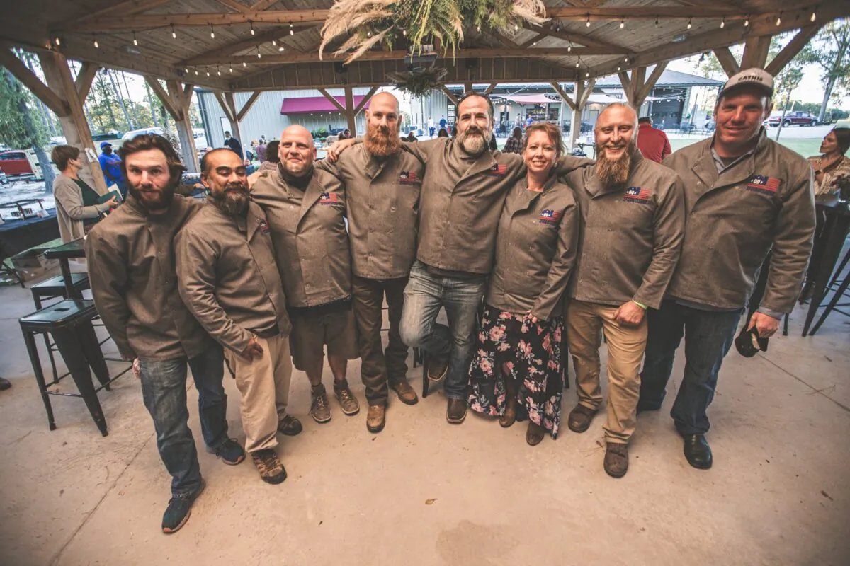 Robert Elliott (fourth from right), founder of the Veteran's Farm of North Carolina (VFNC), with several of his fellow veterans-turned-farmers at one of VFNC's events. (Courtesy of VFNC)