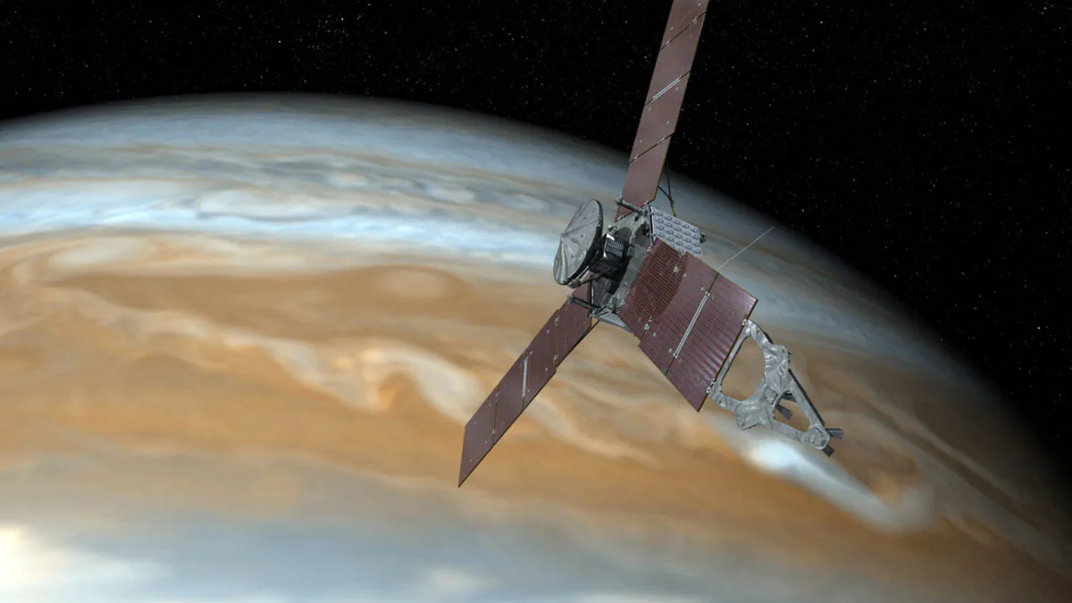 This illustration depicts NASA's Juno spacecraft making one of its close passes over Jupiter. (NASA via AP)