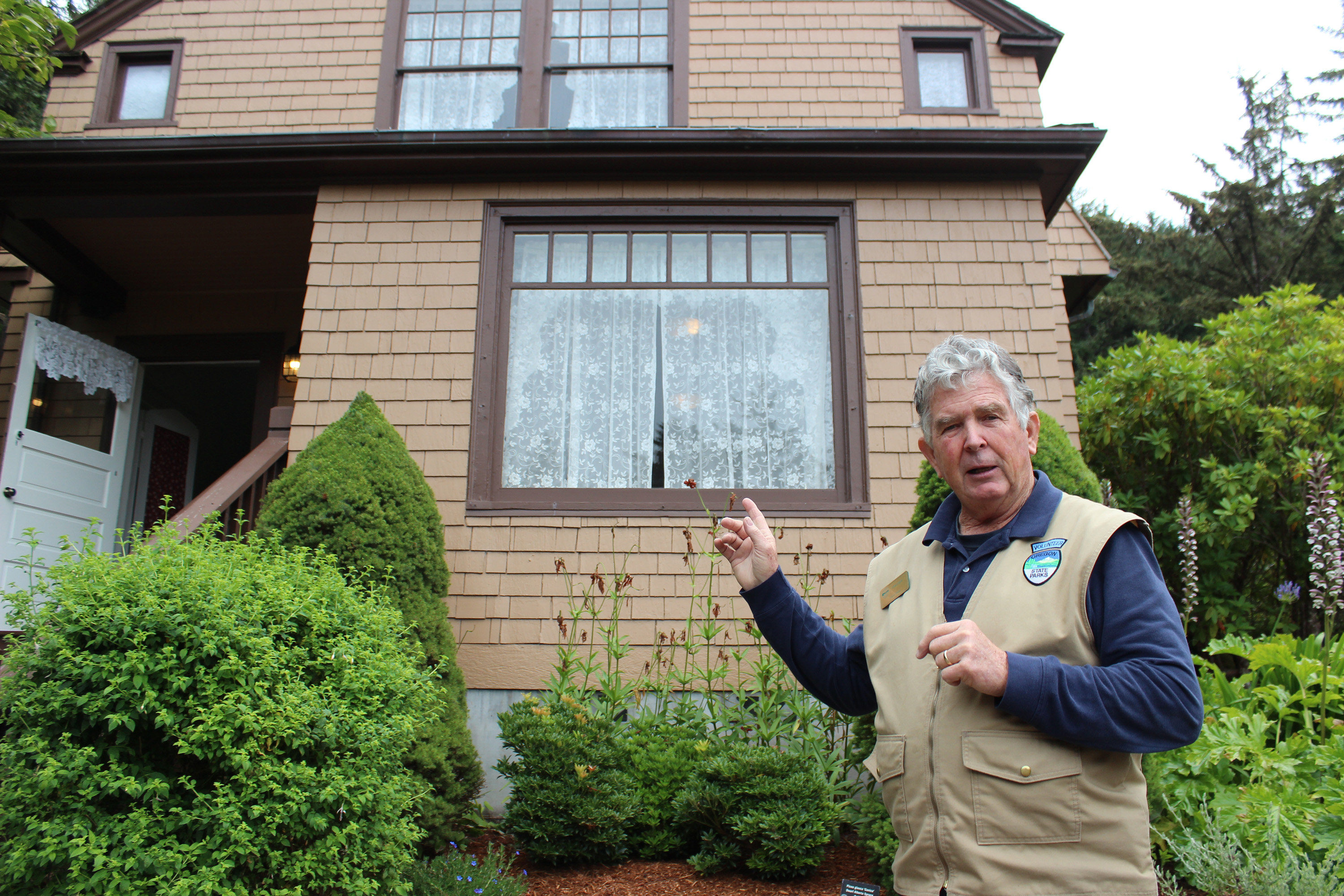Lake Tahoe, Nevada, resident George Schofield, a volunteer camp host at Shore Acres State Park in southern Oregon, tells the history of timber baron Louis J. Simpson outside the gardener's cottage where Simpson once lived.