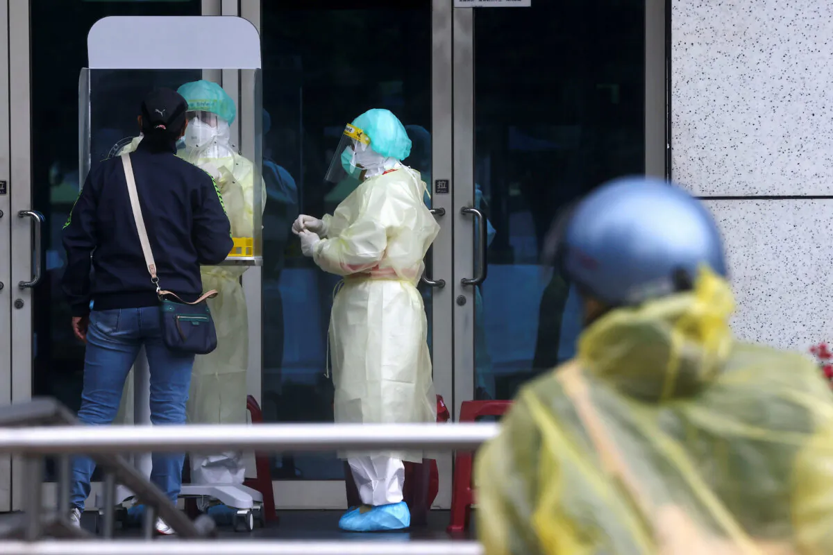 A person gets a coronavirus disease (COVID-19) test in Taipei, Taiwan, on May 24, 2022. (Ann Wang/Reuters)