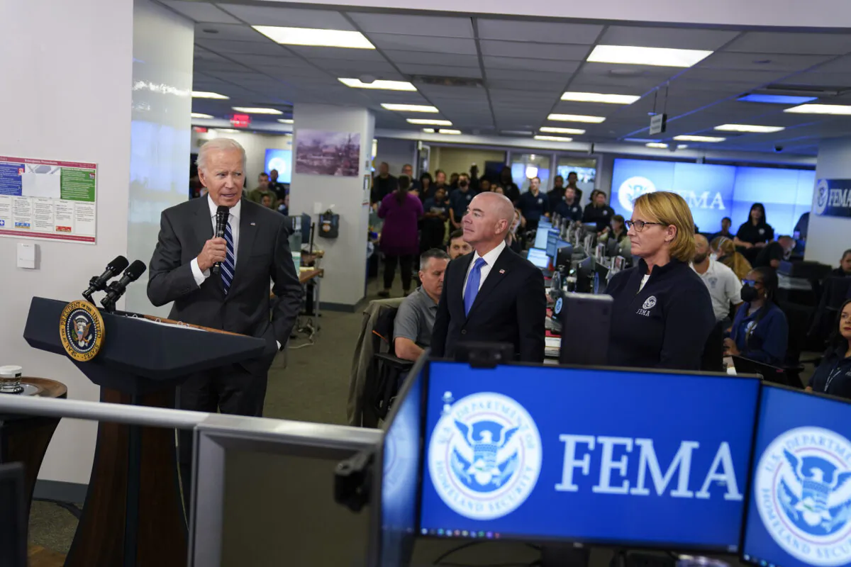 President Joe Biden (L) speaks at FEMA headquarters in Washington as Homeland Security Secretary Alejandro Mayorkas and FEMA Administrator Deanne Criswell watch, on Sept. 29, 2022. (Evan Vucci/AP Photo)