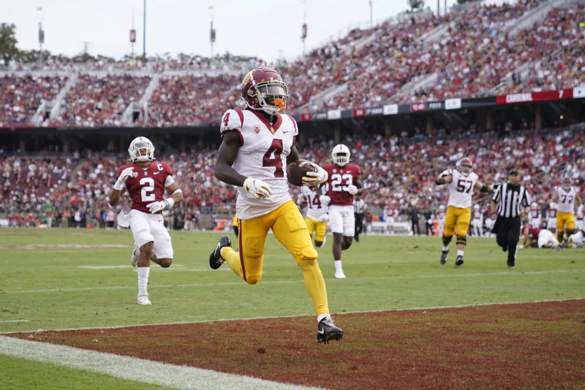Southern California wide receiver Mario Williams (4) scores on a 15-yard touchdown reception against Stanford during the first half of an NCAA college football game in Stanford, Calif., on Sept. 10, 2022. (Godofredo A. Vasquez/AP Photo)