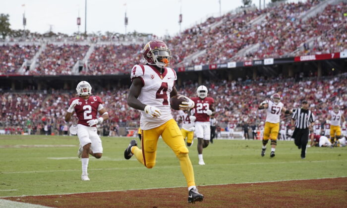 Southern California wide receiver Mario Williams (4) scores on a 15-yard touchdown reception against Stanford during the first half of an NCAA college football game in Stanford, Calif., on Sept. 10, 2022. (Godofredo A. Vasquez/AP Photo)