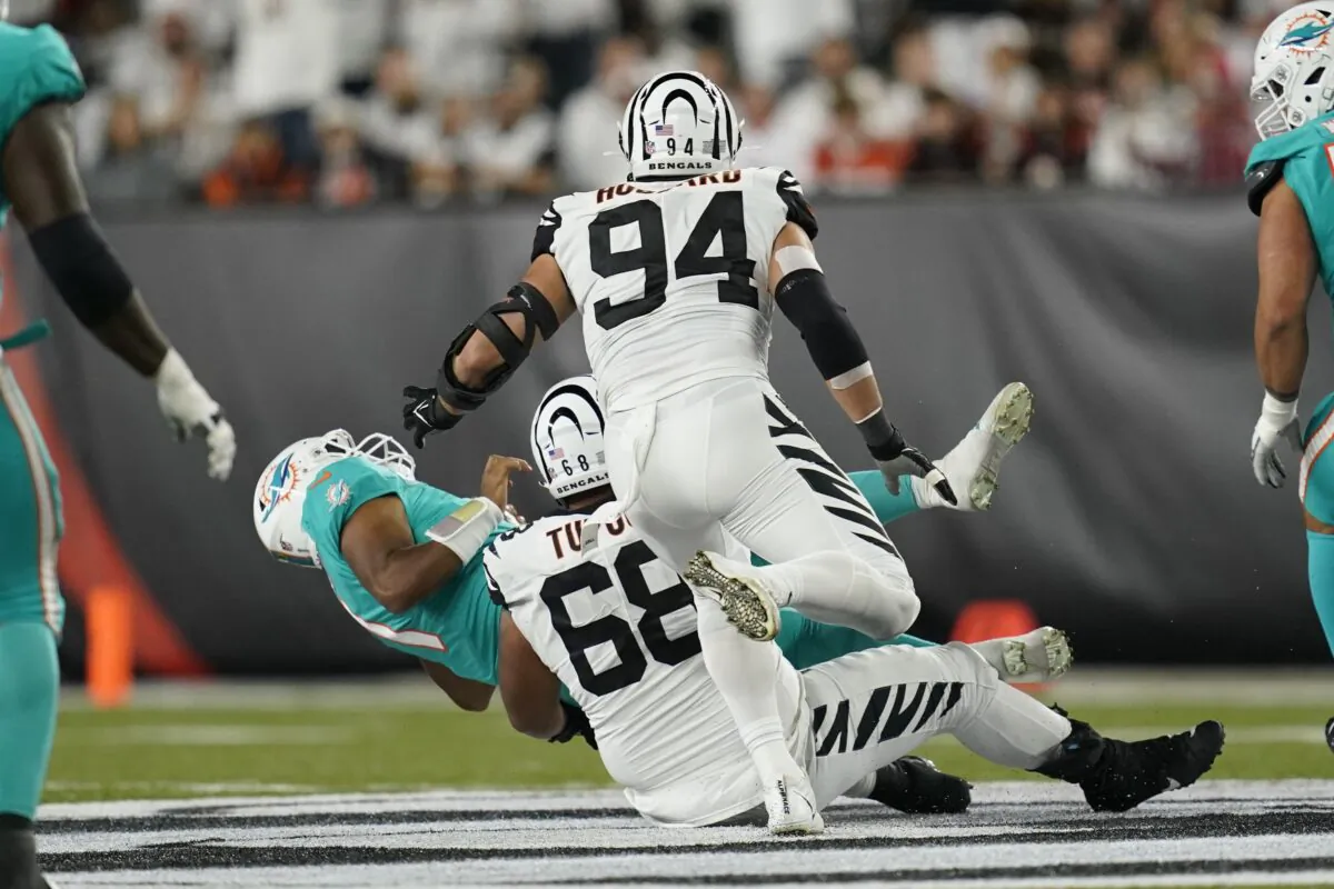 Miami Dolphins quarterback Tua Tagovailoa (1) is sacked by Cincinnati Bengals' Josh Tupou (68) during the first half of an NFL football game in Cincinnati, Ohio, on Sept. 29, 2022. (Joshua A. Bickel/AP Photo)