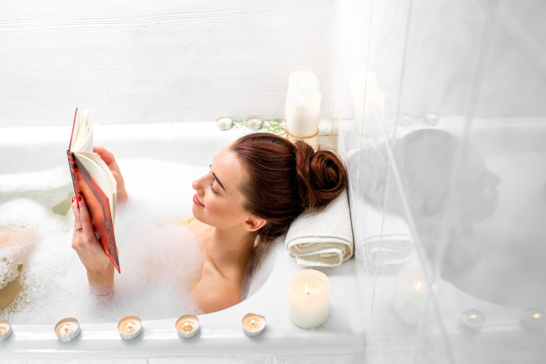 Wind down before bed by taking a hot bath or reading a book to ensure you receive a good night's sleep. (RossHelen/Shutterstock)