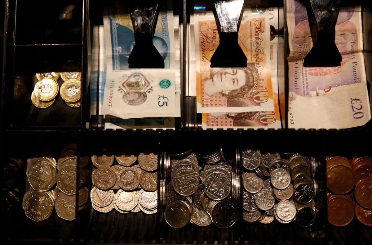 Pound Sterling notes and change are seen inside a cash register in a coffee shop in Manchester, Britain, on Sept. 21, 2018. (Phil Noble/Reuters)