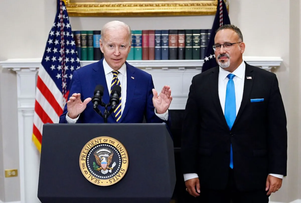 President Joe Biden announces student loan relief with Education Secretary Miguel Cardona (R) at the White House on Aug. 24, 2022. (Olivier Douliery/AFP via Getty Images)