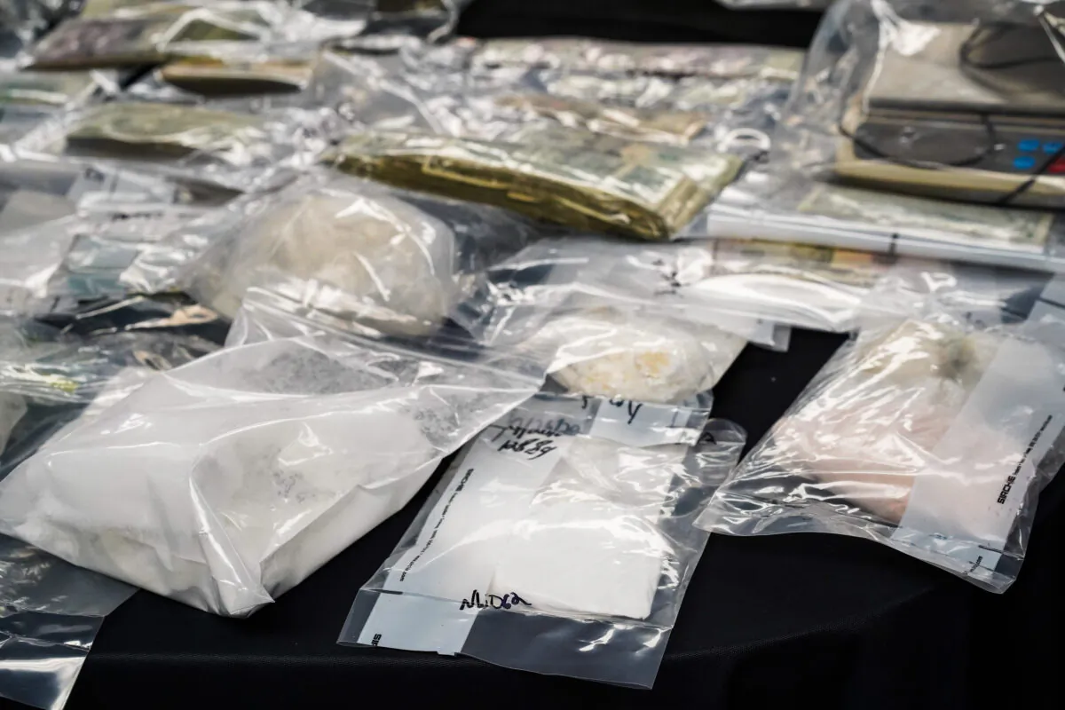 Illegal drugs and cash seized during drug raids on Sept. 26 is on display druing a press conference at Port Jervis City Hall in N.Y., on September 28, 2022. (Cara Ding/The Epoch Times)