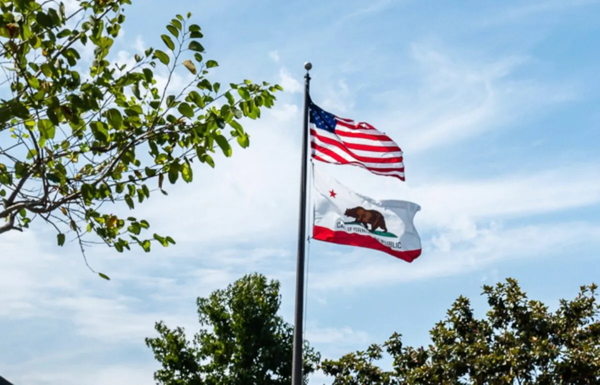 Flags fly at the offices of Irvine Unified School District in Irvine, Calif., on Sept. 8, 2022. (John Fredricks/The Epoch Times)