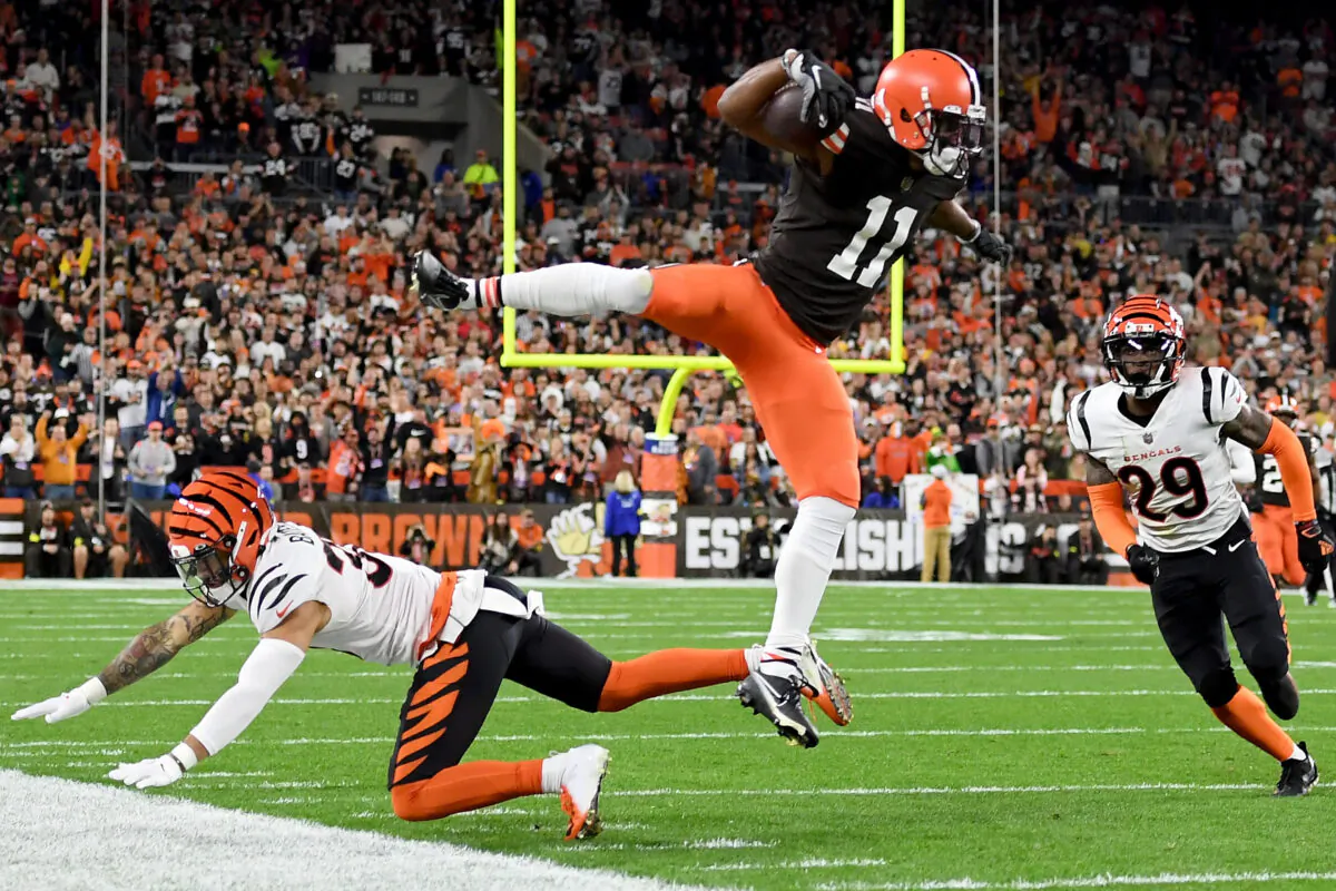 Donovan Peoples-Jones (11) of the Cleveland Browns leaps over Jessie Bates III (30) of the Cincinnati Bengals in the first half at FirstEnergy Stadium Browns thrashed Cincinnati, in Cleveland, on Oct. 31, 2022. (Nick Cammett/Getty Images)