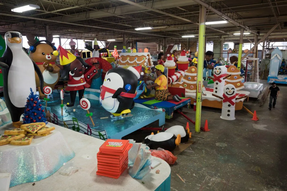 A staff member walks through Santa's Secret Workshop, ahead of the virtual Santa Claus Parade, in Toronto on Dec. 1, 2021. (The Canadian Press/Tijana Martin)
