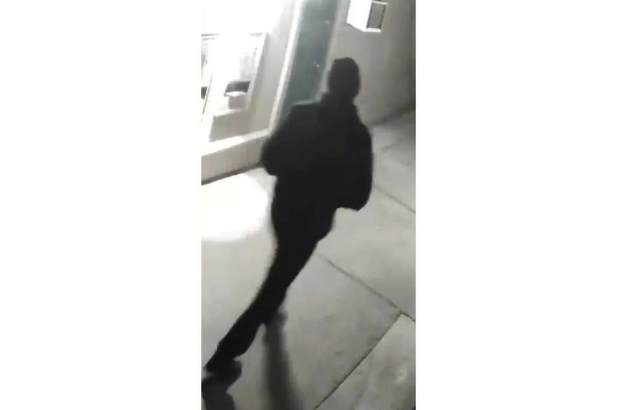 A person is shown from behind, in Stockton, Calif., in an undated surveillance image. (Stockton Police Department via AP)