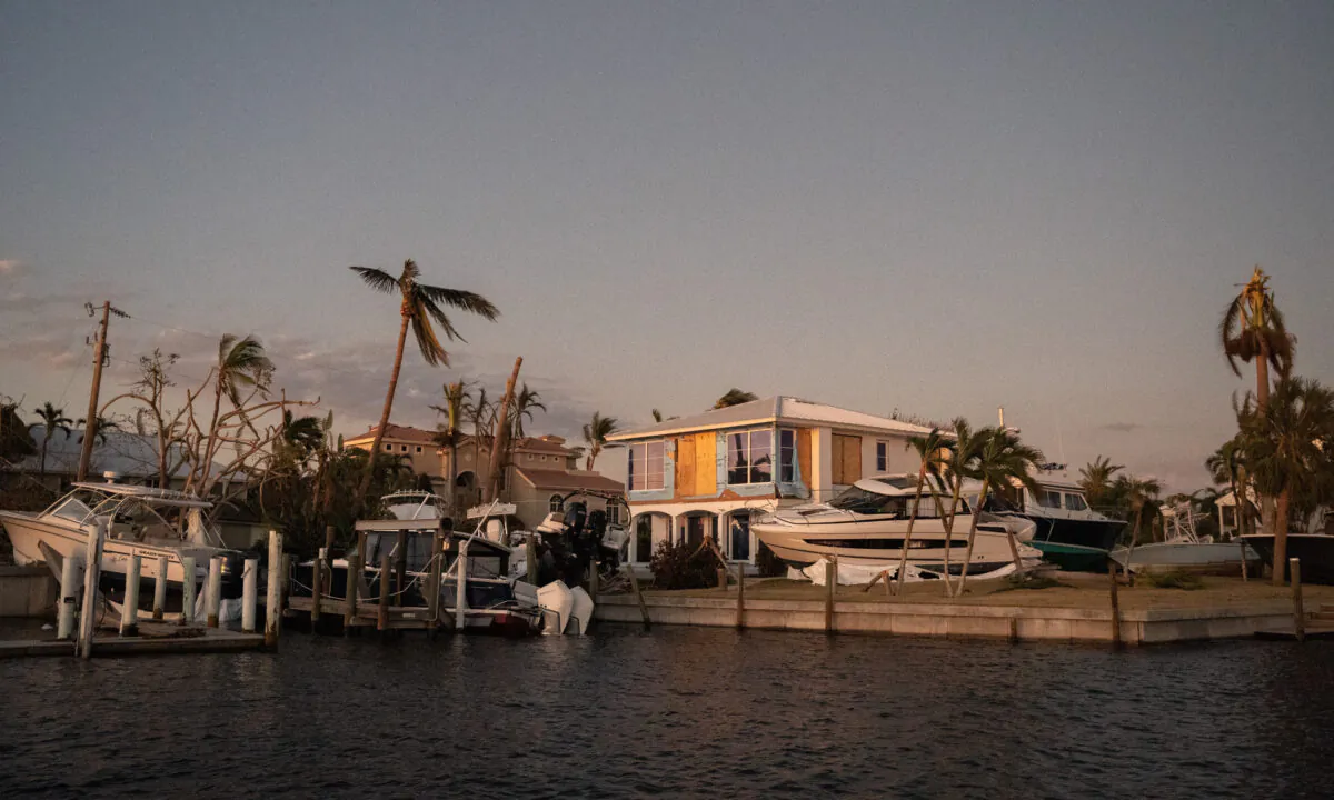 Boats litter a canal residence on Sanibel Island, Fla., on Oct. 1, 2022. (Sean Rayford/Getty Images)