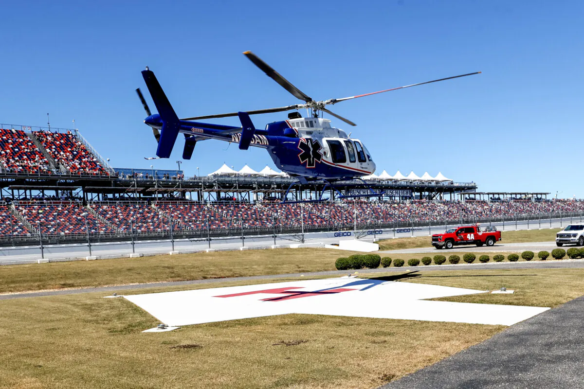 Driver Jordan Anderson airlifted by a helicopter to a local hospital after a fiery crash during the NASCAR Trucks Chevrolet Silverado 250 auto race in Talladega, Ala., on Oct. 1, 2022. (Butch Dill/AP Photo)