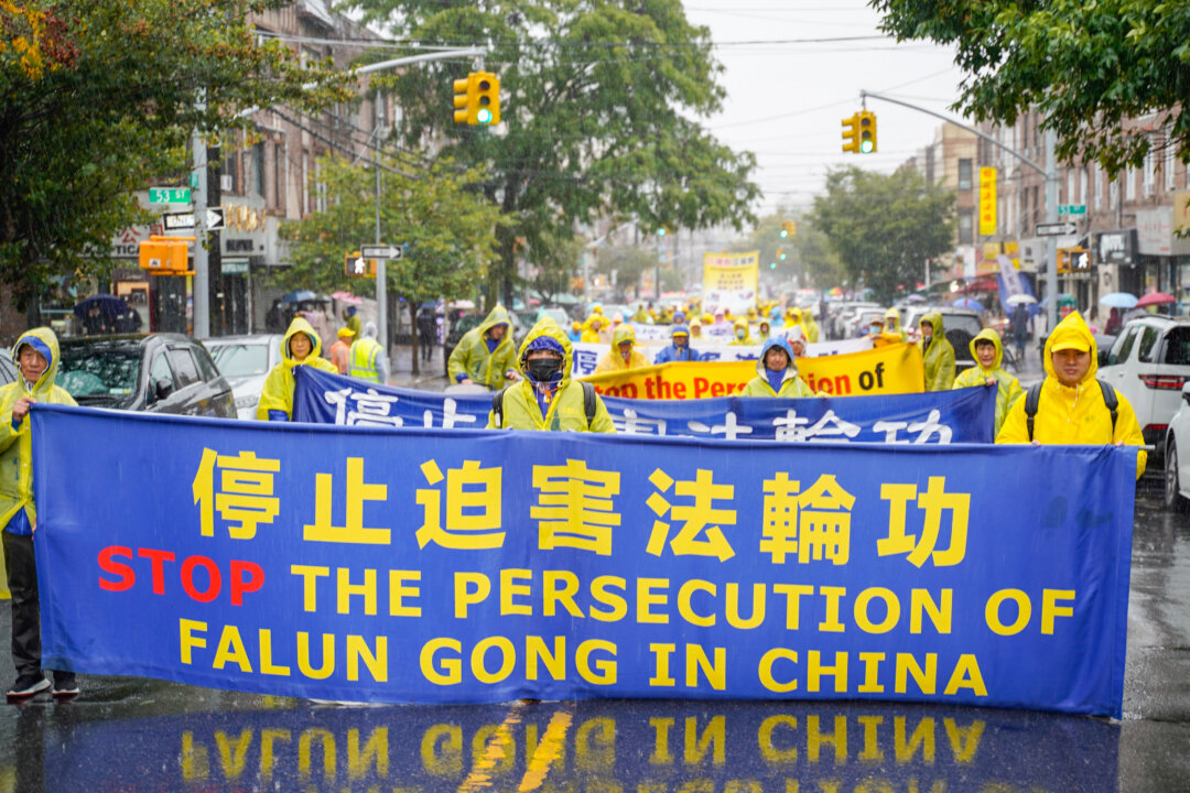 Falun Gong practitioners attend a parade in Brooklyn, New York City, on Oct. 2 to call an end to the Chinese regime's persecution. (Zhang Jingchu/The Epoch Times).