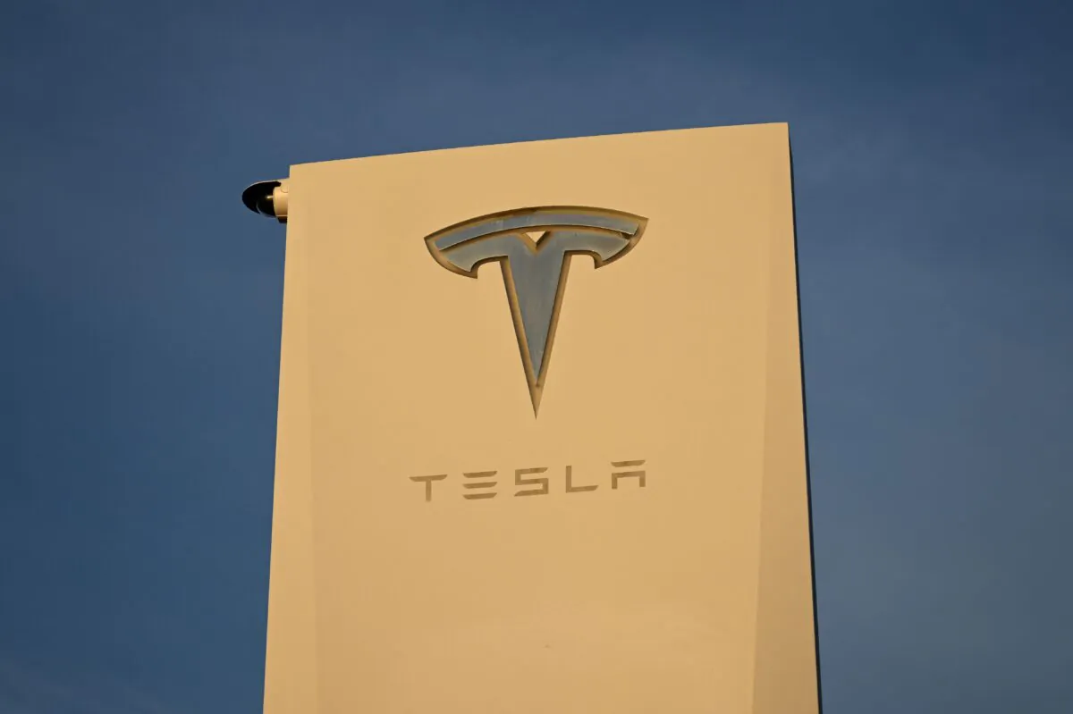 The Tesla Inc. logo on a sign outside the Tesla Design Center in Hawthorne, Calif., on Aug. 9, 2022. (Patrick T. Fallon/AFP via Getty Images)