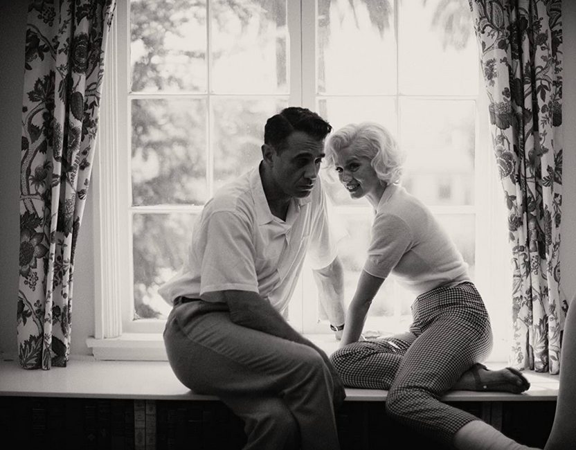 man and woman in window in BLONDE