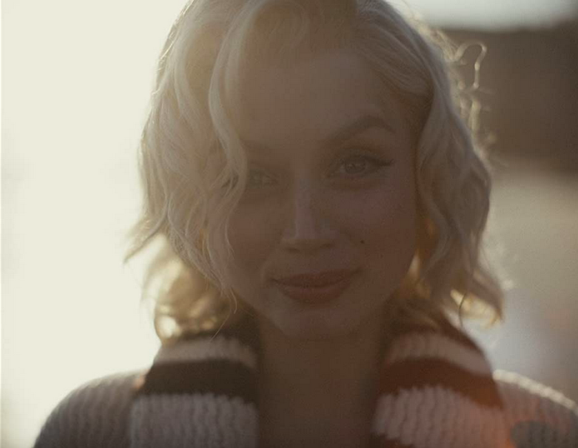 woman in sweater in BLONDE