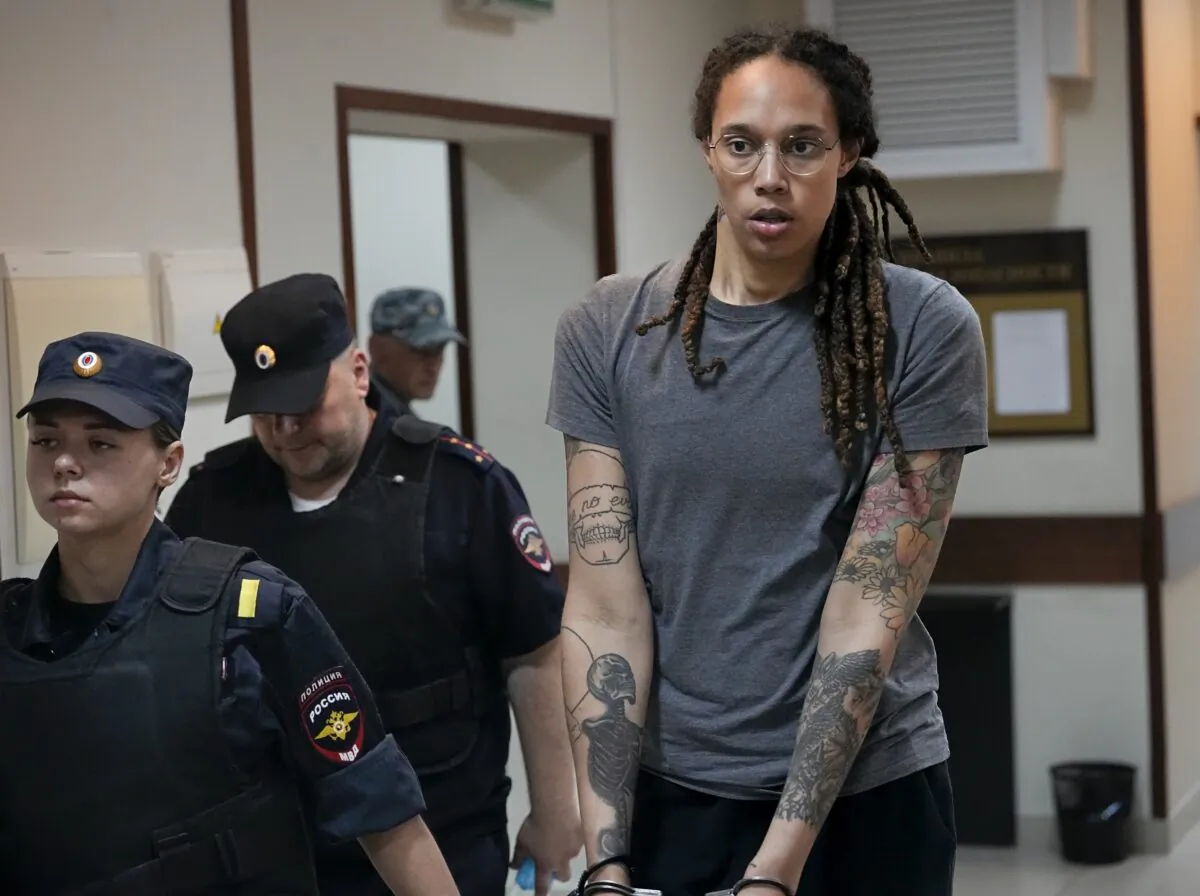 WNBA star and two-time Olympic gold medalist Brittney Griner is escorted from a courtroom after a hearing in Khimki just outside Moscow on Aug. 4, 2022. (Alexander Zemlianichenko/AP Photo)