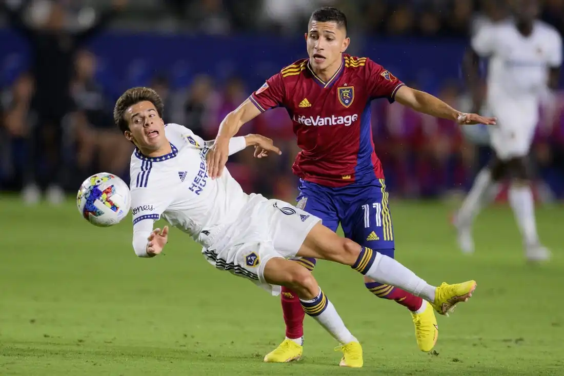 Riqui Puig of the L.A. Galaxy battles Jefferson Savarino of Real Salt Lake for the ball at Dignity Health Sports Park in Salt Lake City, Utah, on Oct. 1, 2022. (Field Level Media)