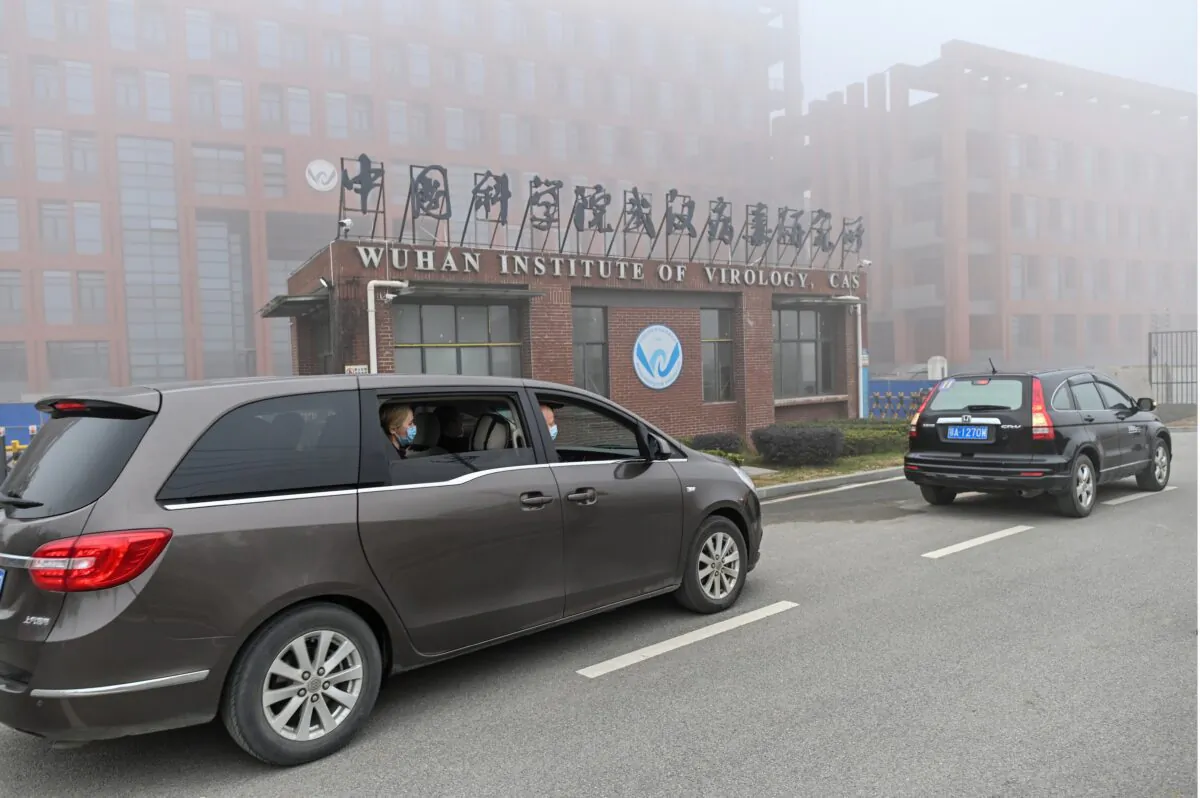 Peter Daszak (R), Thea Fischer (L) and other members of the World Health Organization team investigating the origins of the virus that causes COVID-19, arrive at the Wuhan Institute of Virology in Wuhan in China's central Hubei Province on Feb. 3, 2021. (Hector Retamal/AFP via Getty Images)
