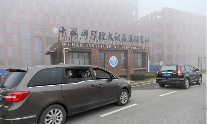 Peter Daszak (R), Thea Fischer (L) and other members of the World Health Organization (WHO) team investigating the origins of the COVID-19 coronavirus, arrive at the Wuhan Institute of Virology in Wuhan in China's central Hubei province on Feb. 3, 2021. (Hector Retamal/AFP via Getty Images)