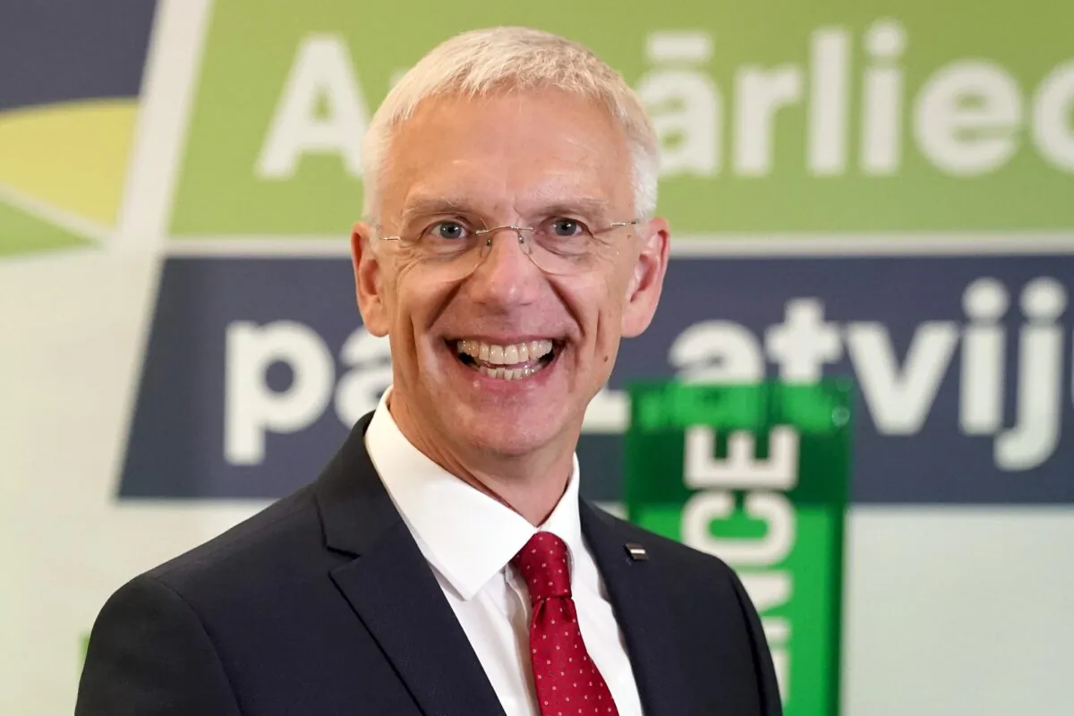 Latvian Prime Minister and Head of board of leading political party Jauna Vienotiba (New Unity) Krisjanis Karins smiles as he speaks to the media while awaiting the results of parliament elections, in Riga, Latvia, on Oct. 1, 2022. (Roman Koksarov/AP Photo)