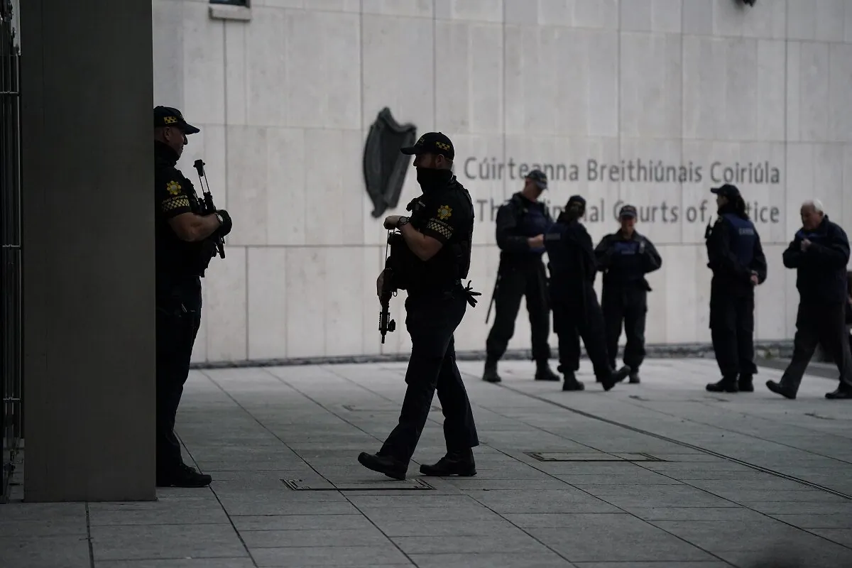 As the trial of Gerry Hutch gets under way armed officers patrol outside the Special Criminal Court in  Dublin, Republic of Ireland, on Oct. 3, 2022. (PA).
