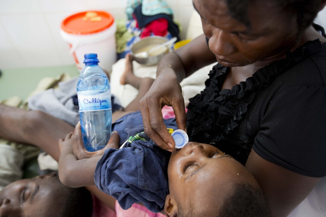 A boy diagnosed with cholera receives treatment at a cholera center in Anse D'Hainault, Haiti, on Oct. 11, 2016. (Dieu Nalio Chery/AP Photo)