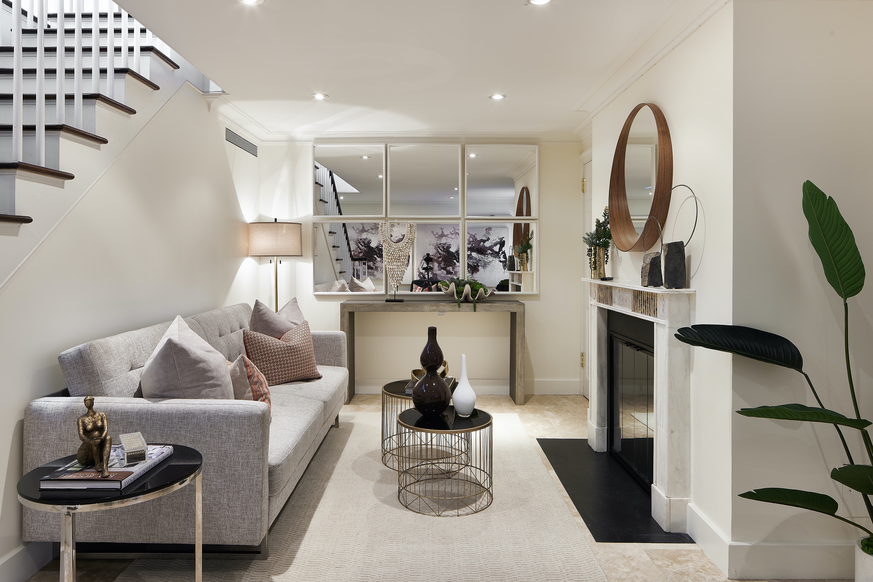 A lower level is made brighter through a creative placement of multiple mirrors.